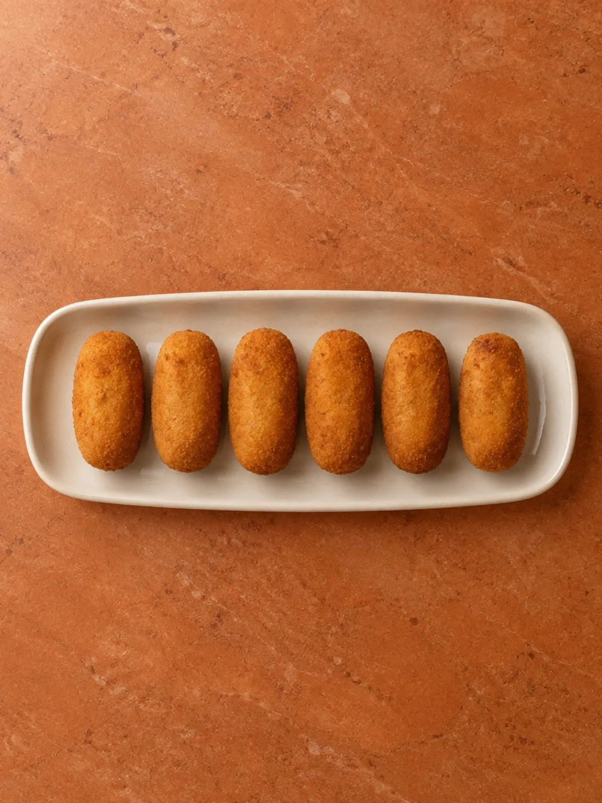 Ham croquetas in a row at Cubano
