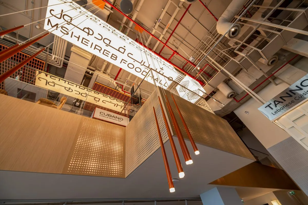 The Msheireb Foodhall sign seen from below the mezzanine